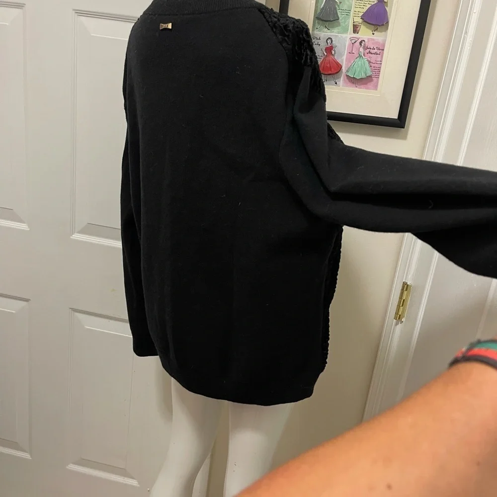 Kate spade black sweater. Looks like Front made with the unique sheep fur.